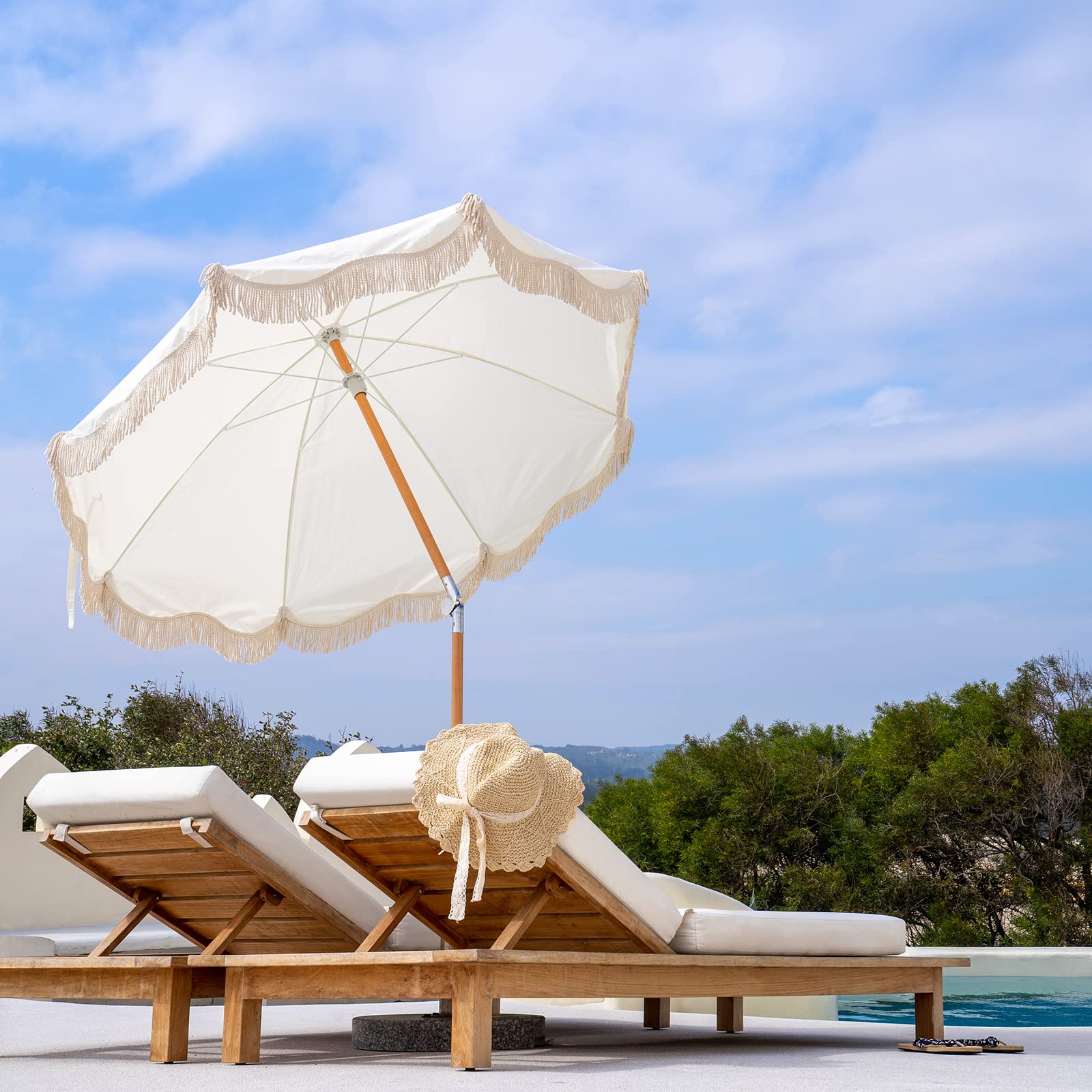 Funsite umbrella over patio table providing shady seating for four
