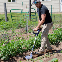 Fusion Drill Powered Tools close-up of four steel tines cutting soil for effective weeding