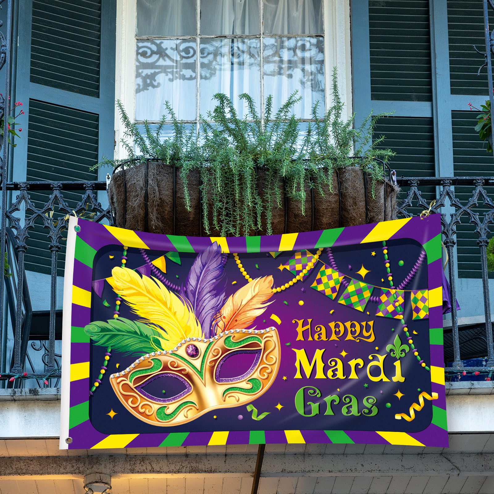 Ganeen flag displayed on a porch creating vibrant Mardi Gras atmosphere for guests