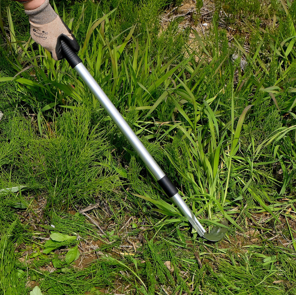 Garden Helper collapsed tool beside a hand to show compact storage and easy transport