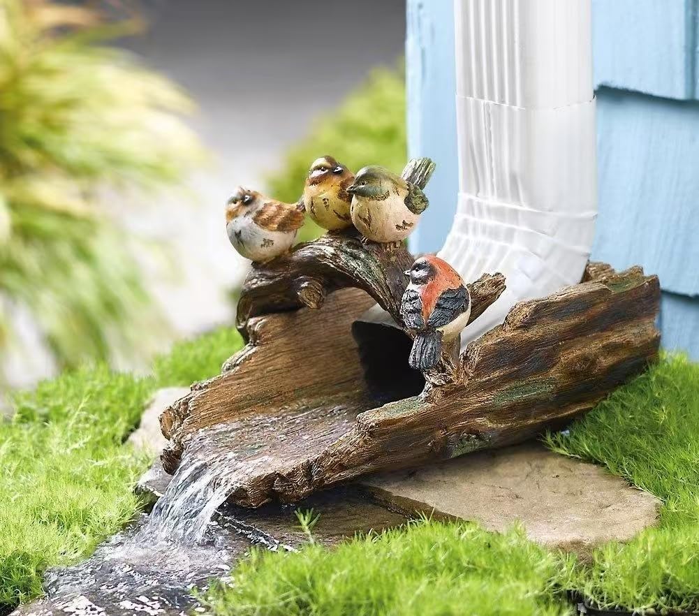 GARDEN WHISPER front view of bird stump splash block adding charm and diverting water