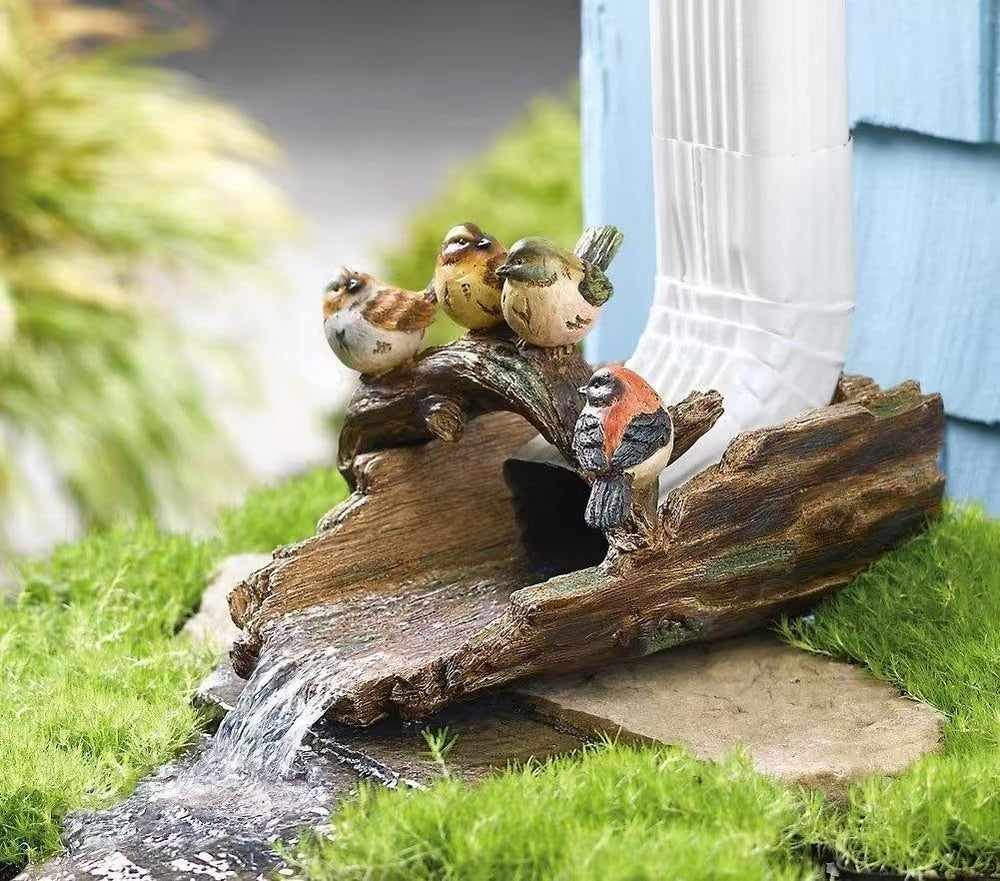 GARDEN WHISPER front view of bird stump splash block adding charm and diverting water