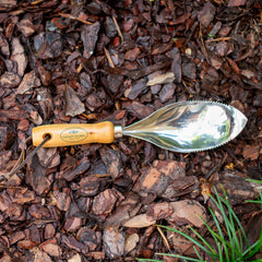 Garden Works Soil Scoop in use filling a pot neatly with less mess for efficient repotting