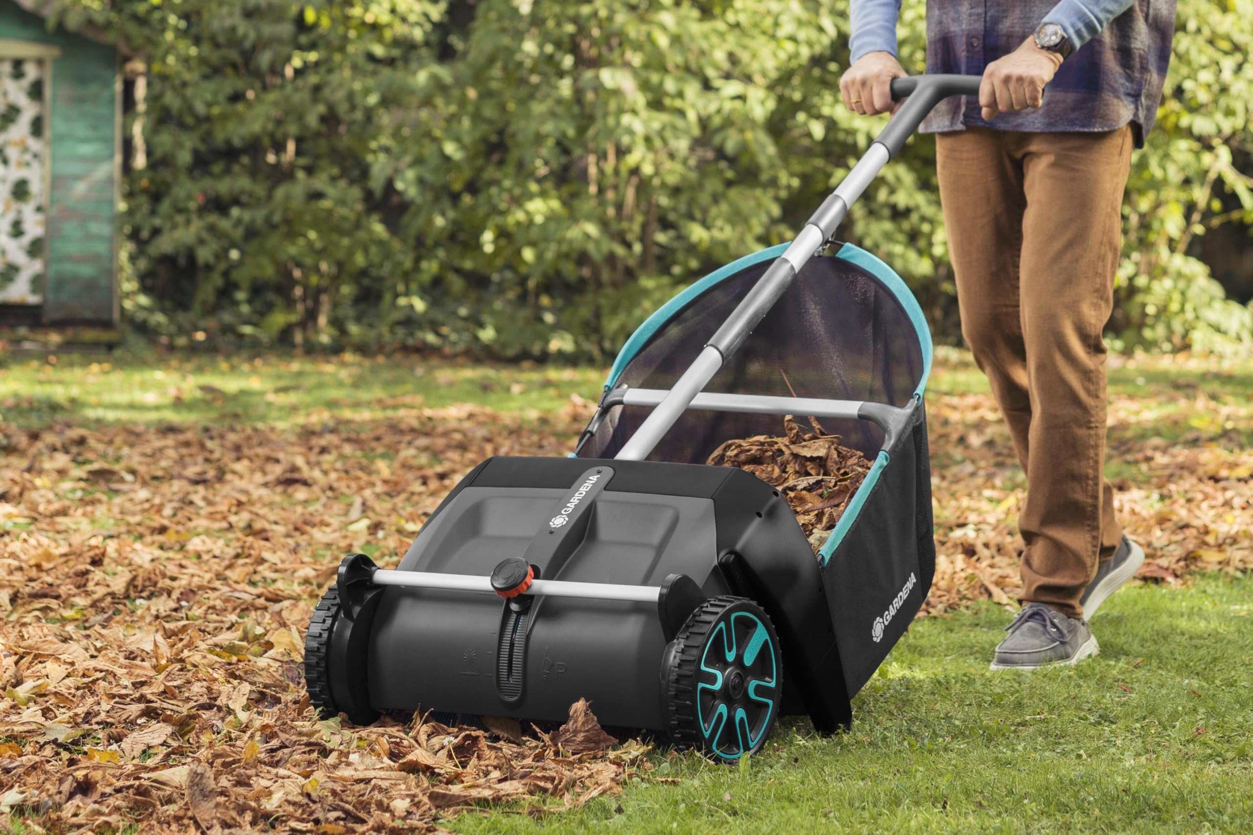 GARDENA rotating brush detail illustrating robust pickup action on grass