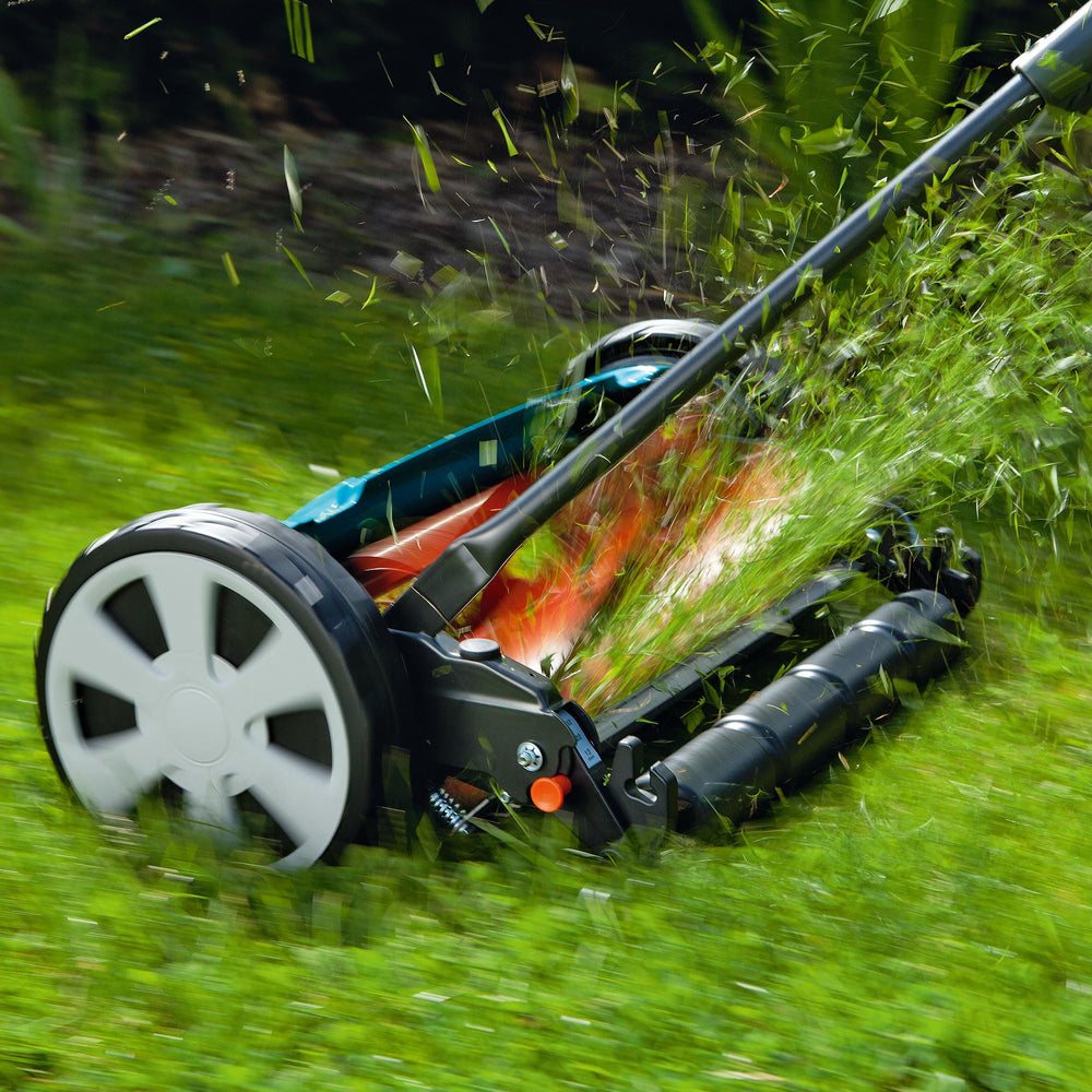 GARDENA mower in use on lawn for quiet, emission-free mowing