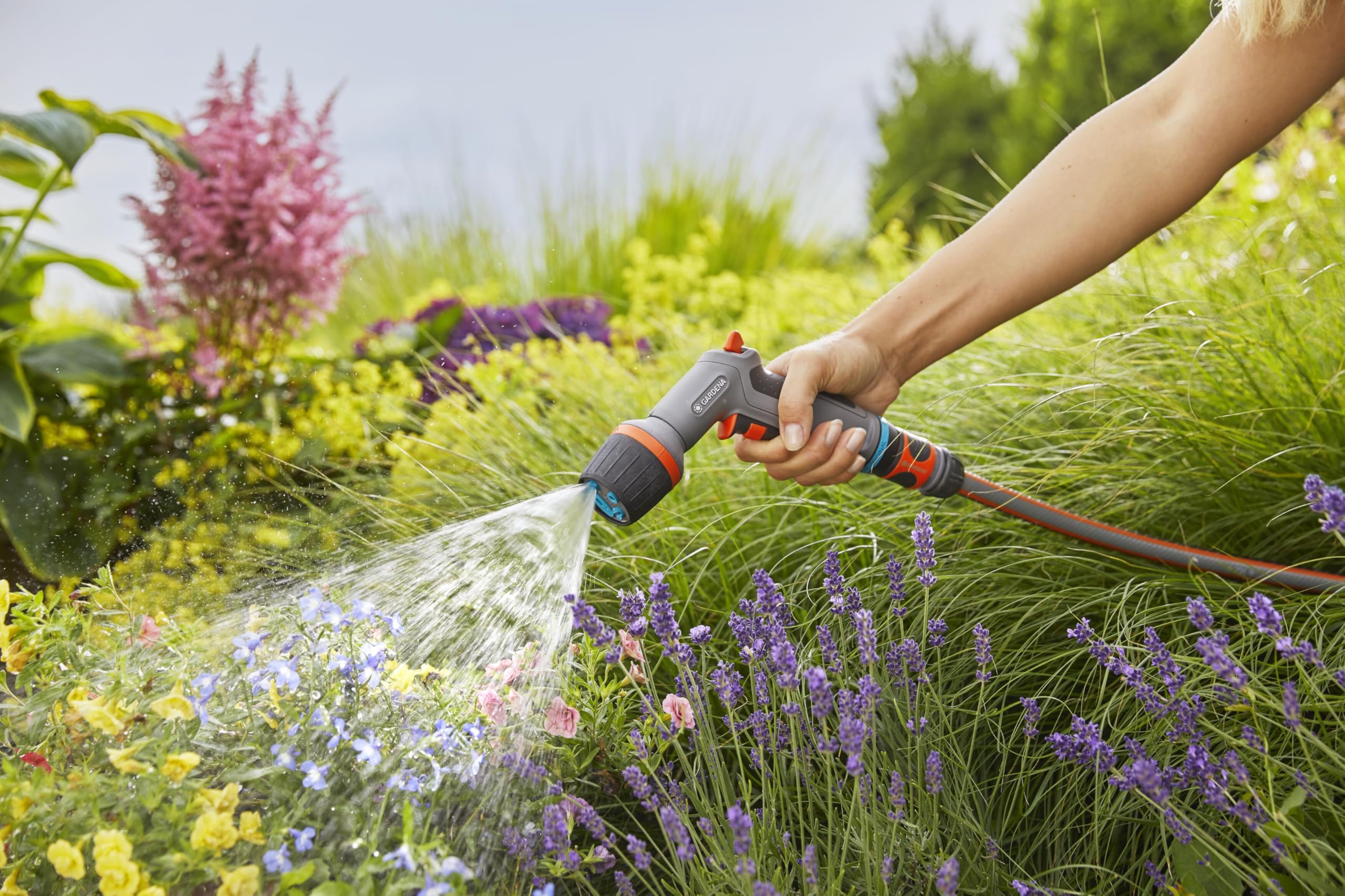 Gardena nozzle cleaning a tiled patio for efficient surface care