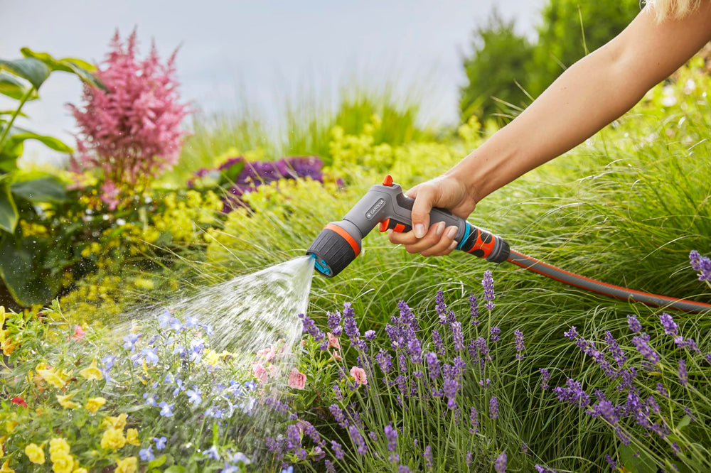Gardena nozzle cleaning a tiled patio for efficient surface care