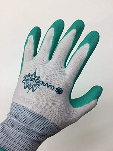 Gardena gloves being rinsed under tap to show washable, quick-dry benefit