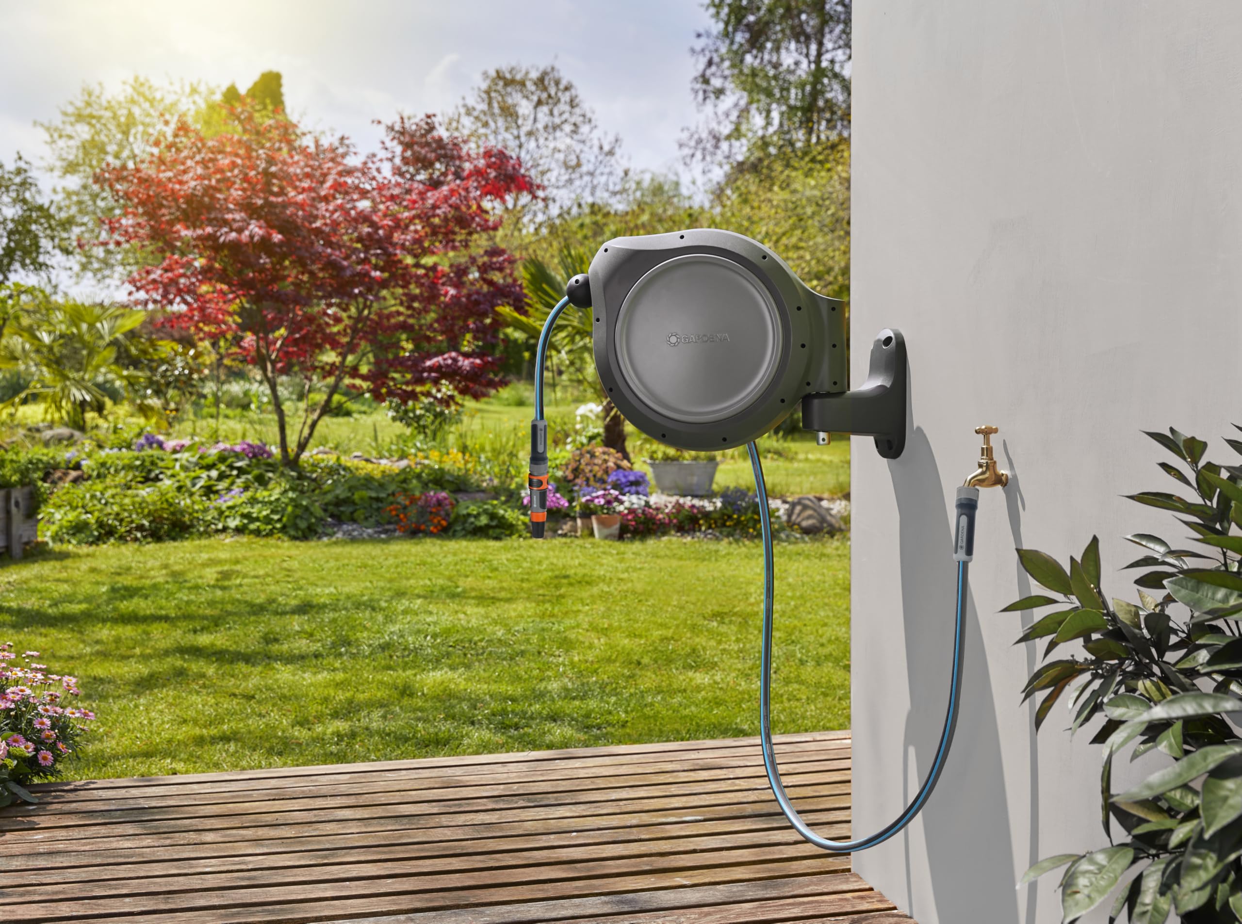 GARDENA hose reel in use watering garden beds for tidy, efficient coverage