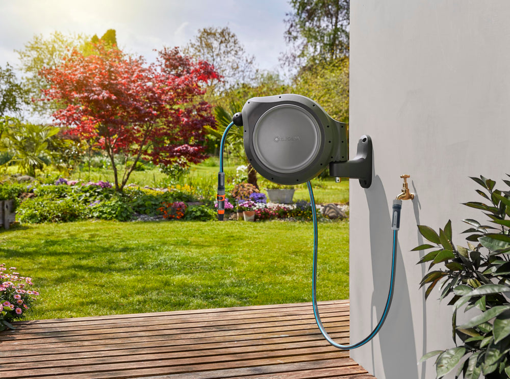 GARDENA hose reel in use watering garden beds for tidy, efficient coverage