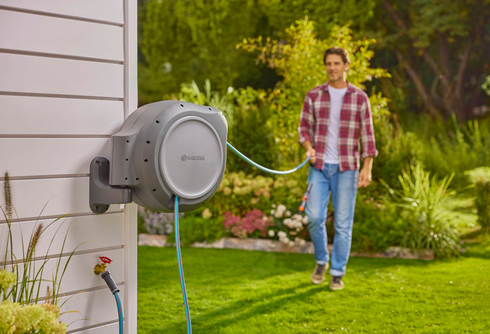 GARDENA mounted reel folded close to wall to protect hose and save space