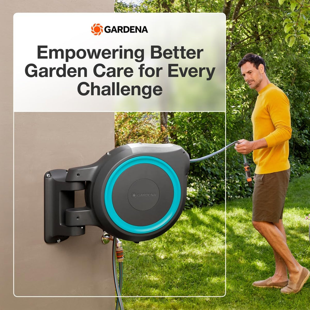 GARDENA reel next to a watering can for scale showing compact footprint