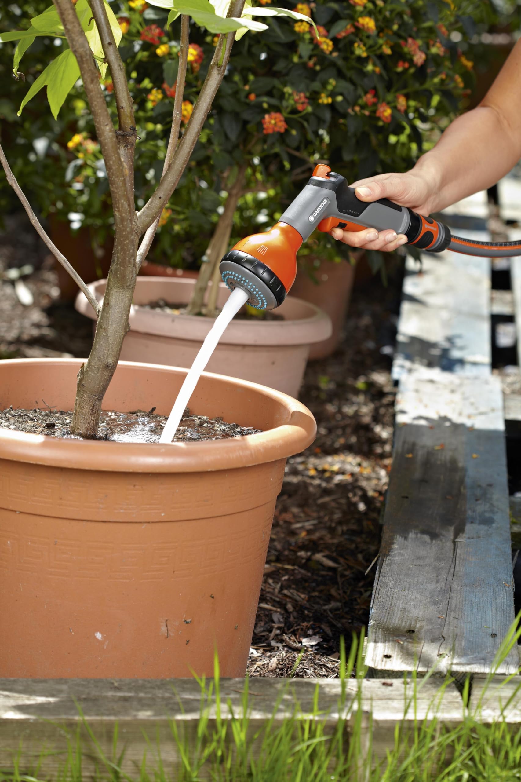 Gardena sprayer held in hand showing compact scale and ergonomic comfort benefit