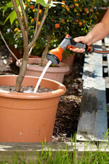 Gardena sprayer held in hand showing compact scale and ergonomic comfort benefit
