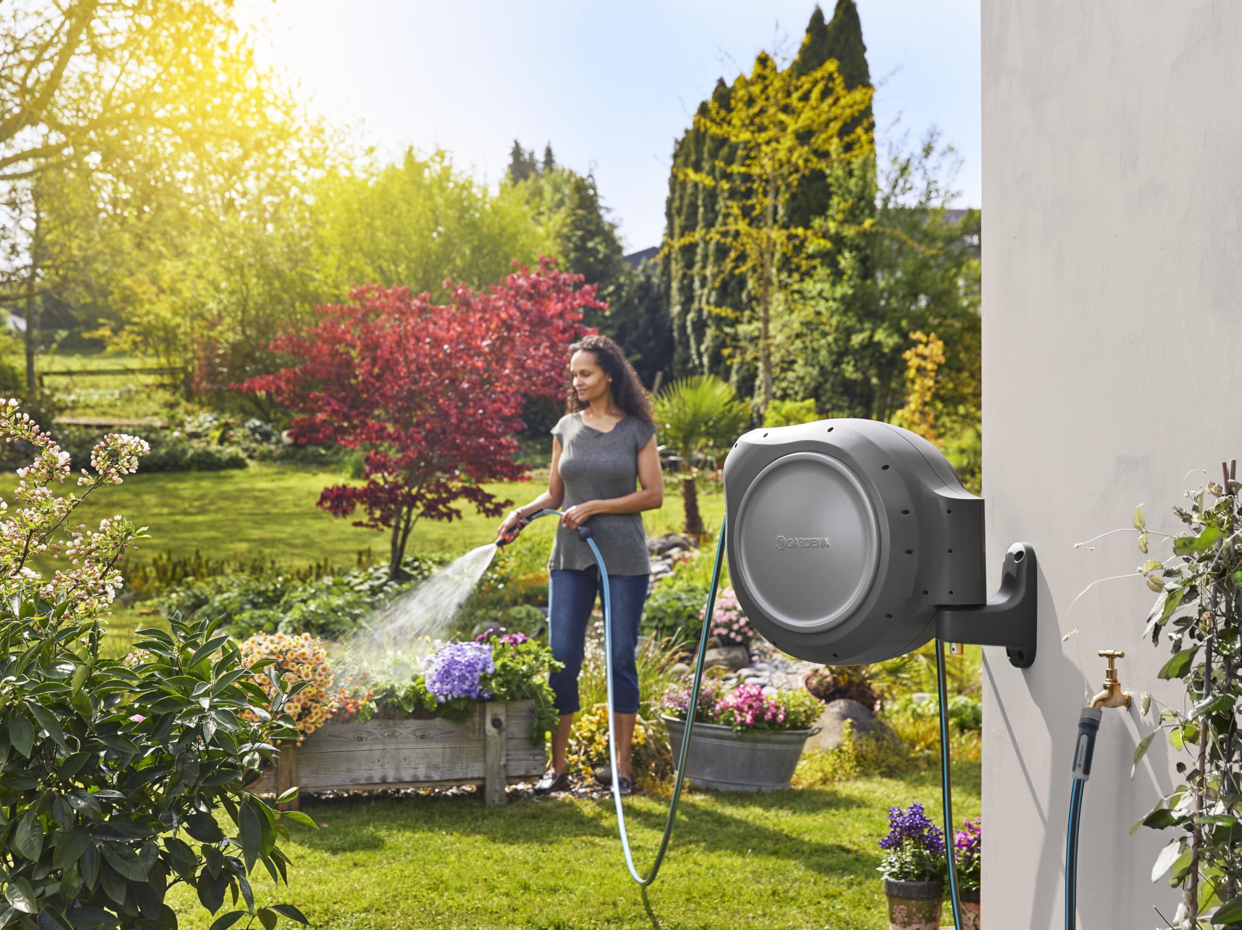 GARDENA reel next to 5 ft connection hose showing scale and fit