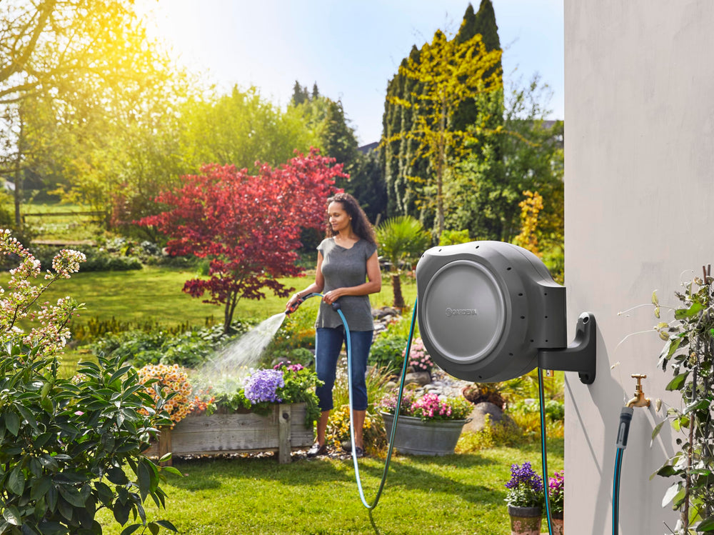 GARDENA reel next to 5 ft connection hose showing scale and fit