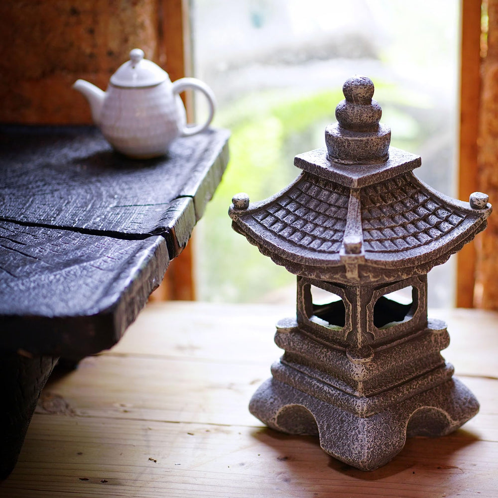 Gardenfans pagoda lit at night casting warm LED glow for ambient outdoor lighting