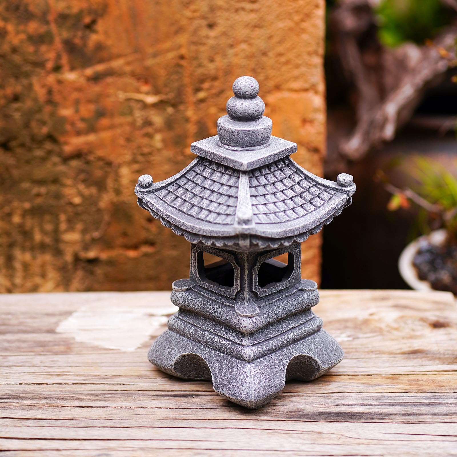 Gardenfans pagoda placed along a garden path adding soft accent illumination