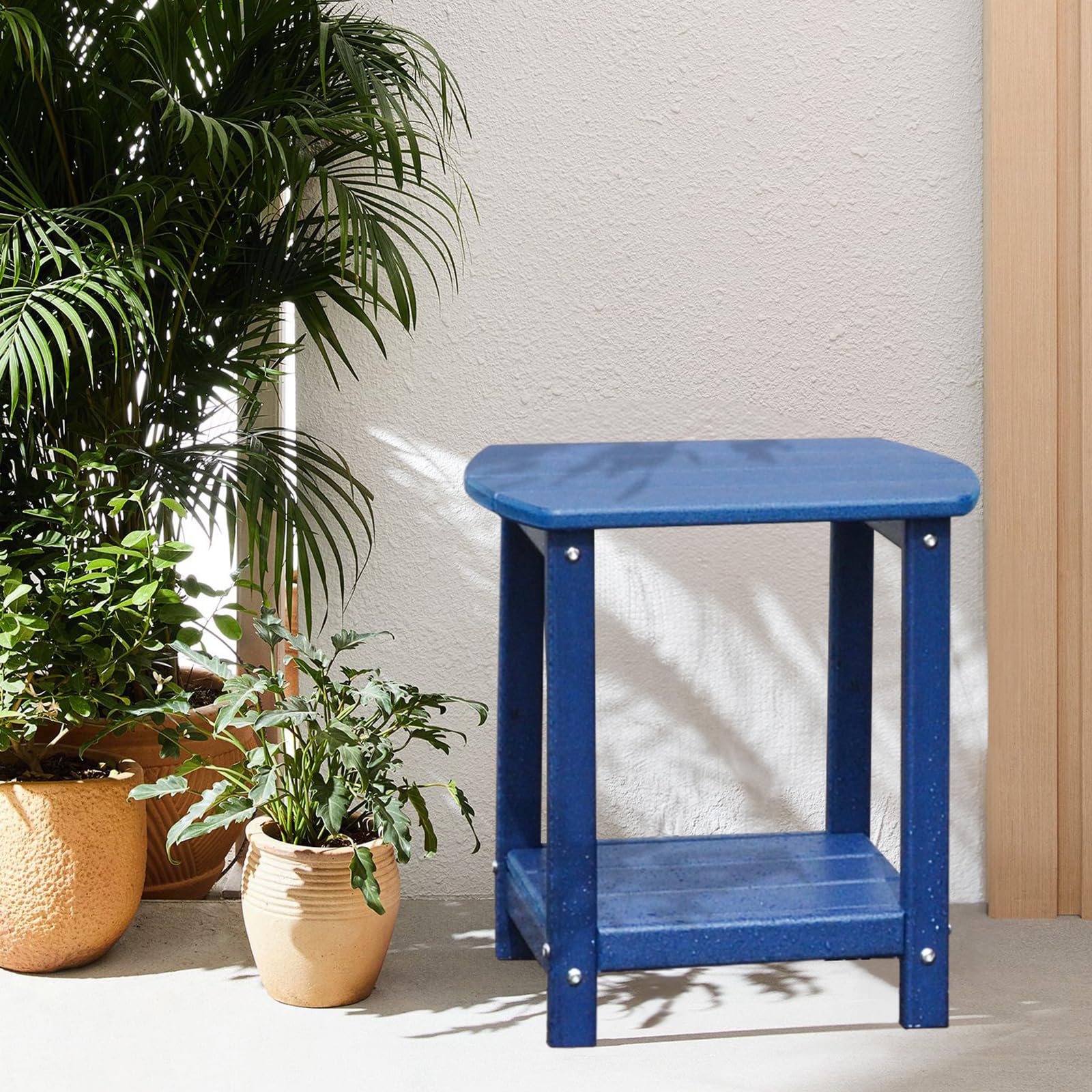 GARDENSTAR table next to Adirondack chair showing compact scale and fit