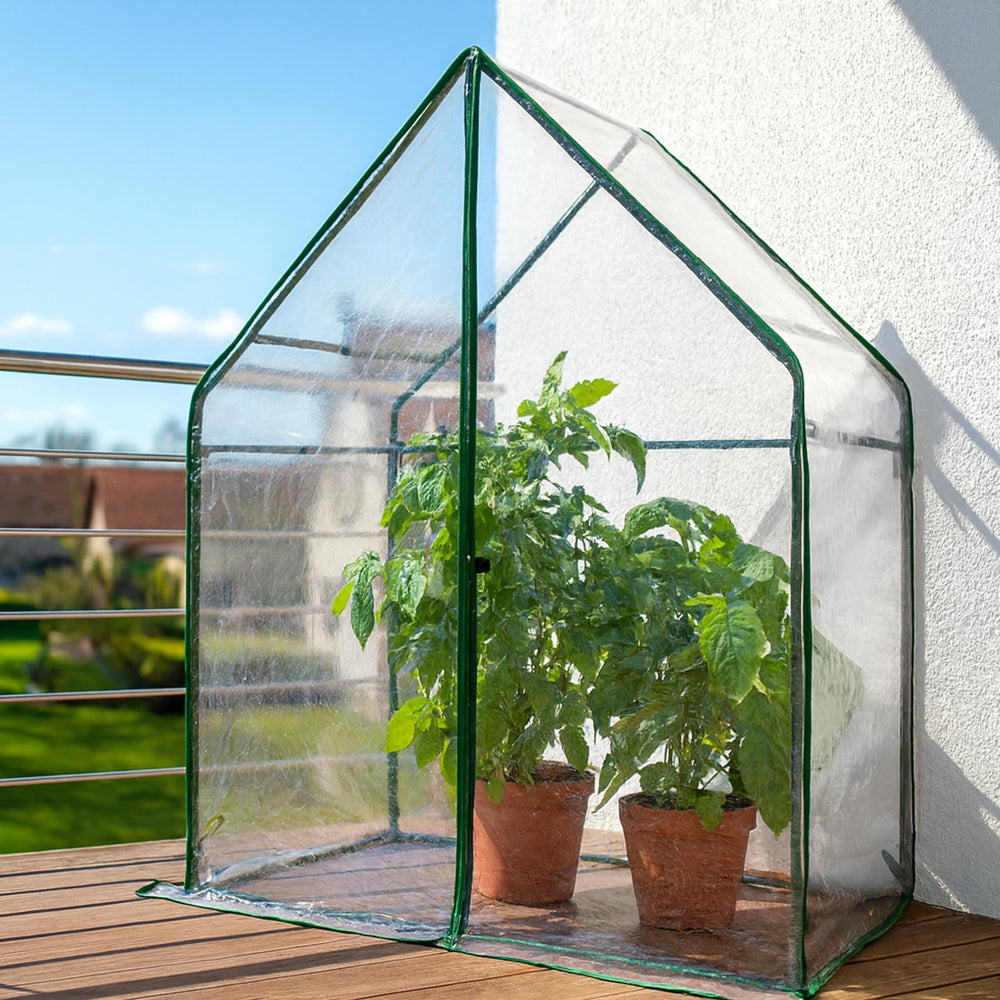 Gardzen greenhouse on patio in use, protecting plants and maximizing space