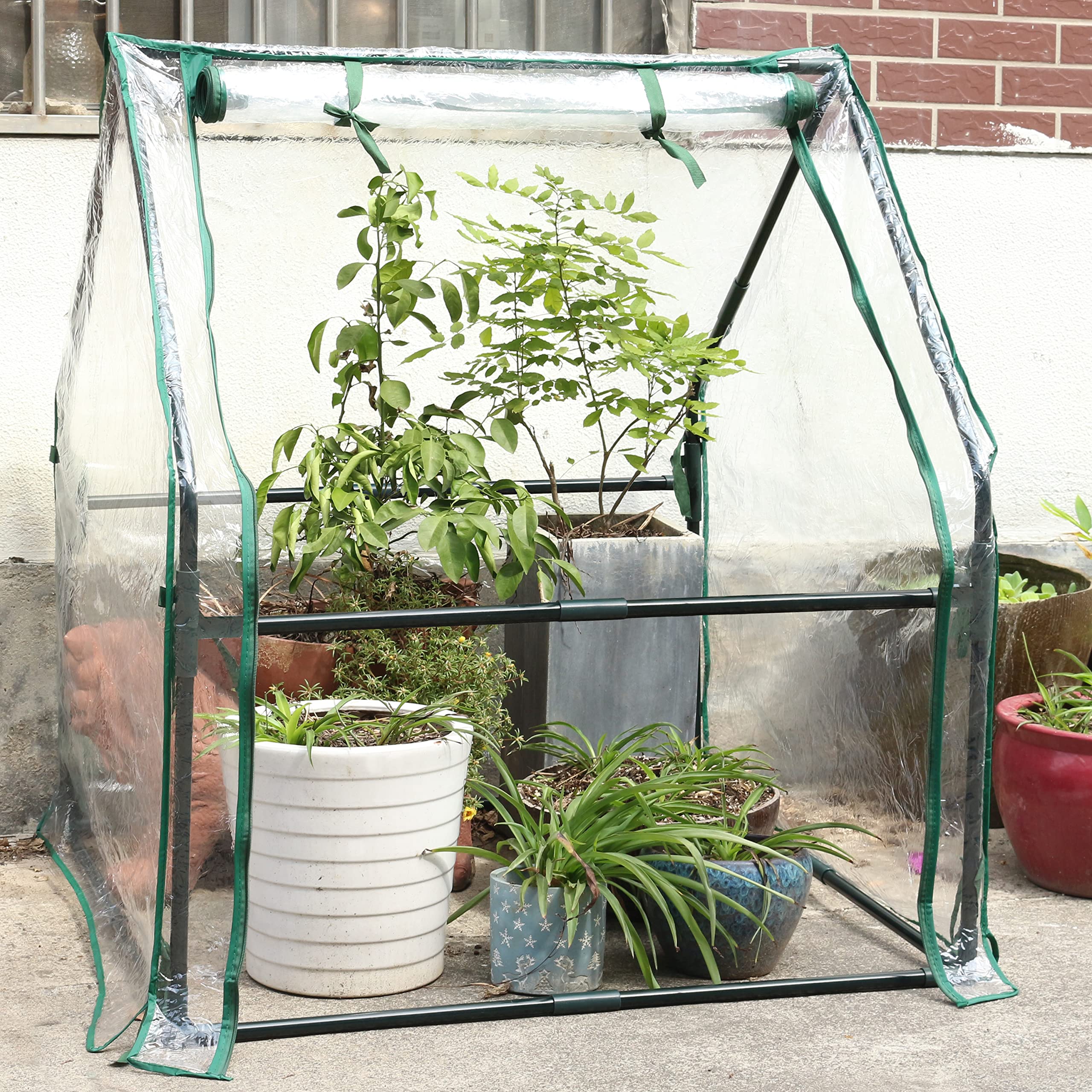 Gardzen mini greenhouse in garden setting offering season extension benefits