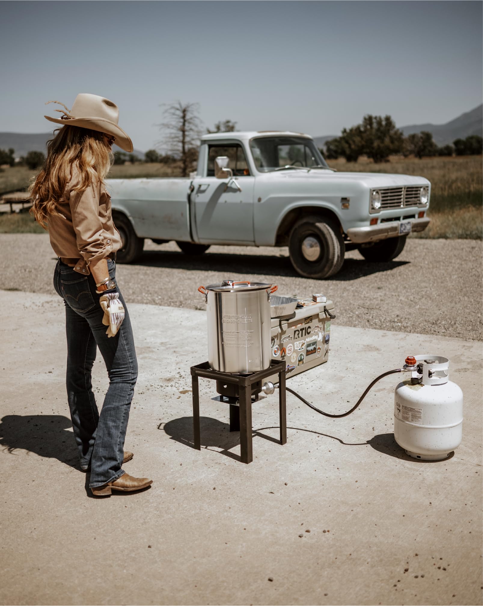 Gas One filled pot next to a person for size comparison and portion planning