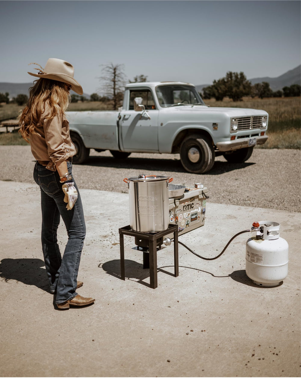 Gas One filled pot next to a person for size comparison and portion planning