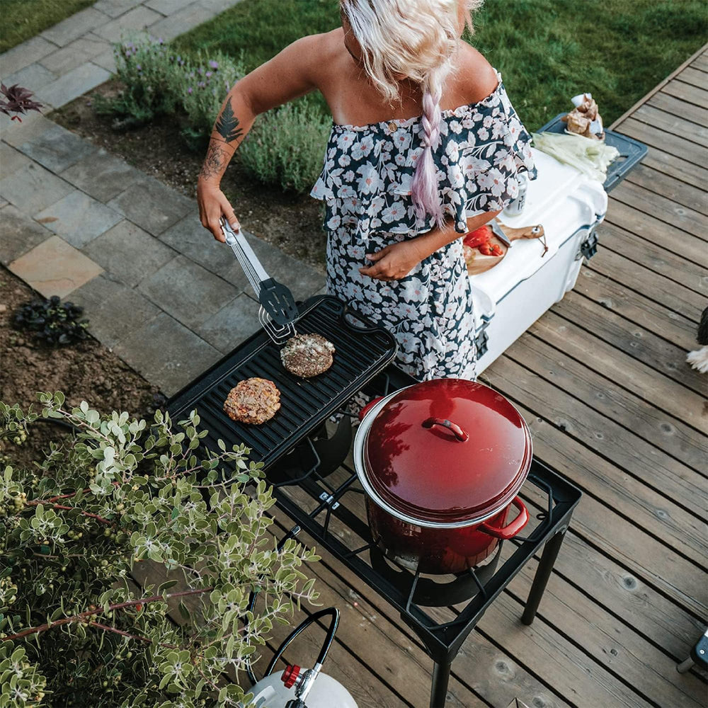 Gas One in tailgate setting showing portable cooking convenience and strong heat for group meals