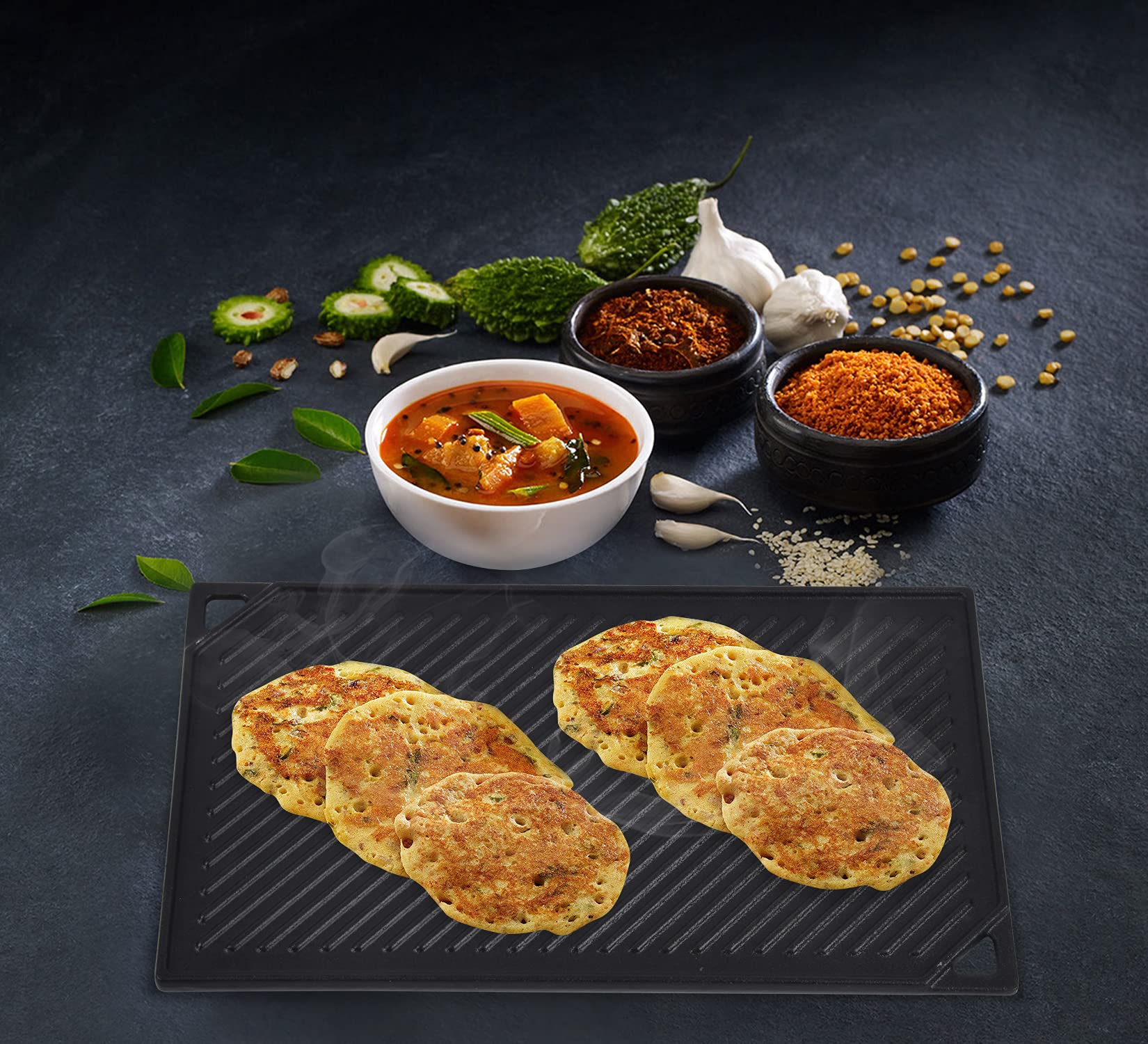 GasSaf griddle next to utensils showing 16.5 x 9.5 size for multiple portions