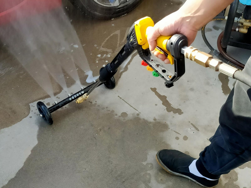 GDHXW gun in use cleaning a driveway demonstrating power and effective debris removal