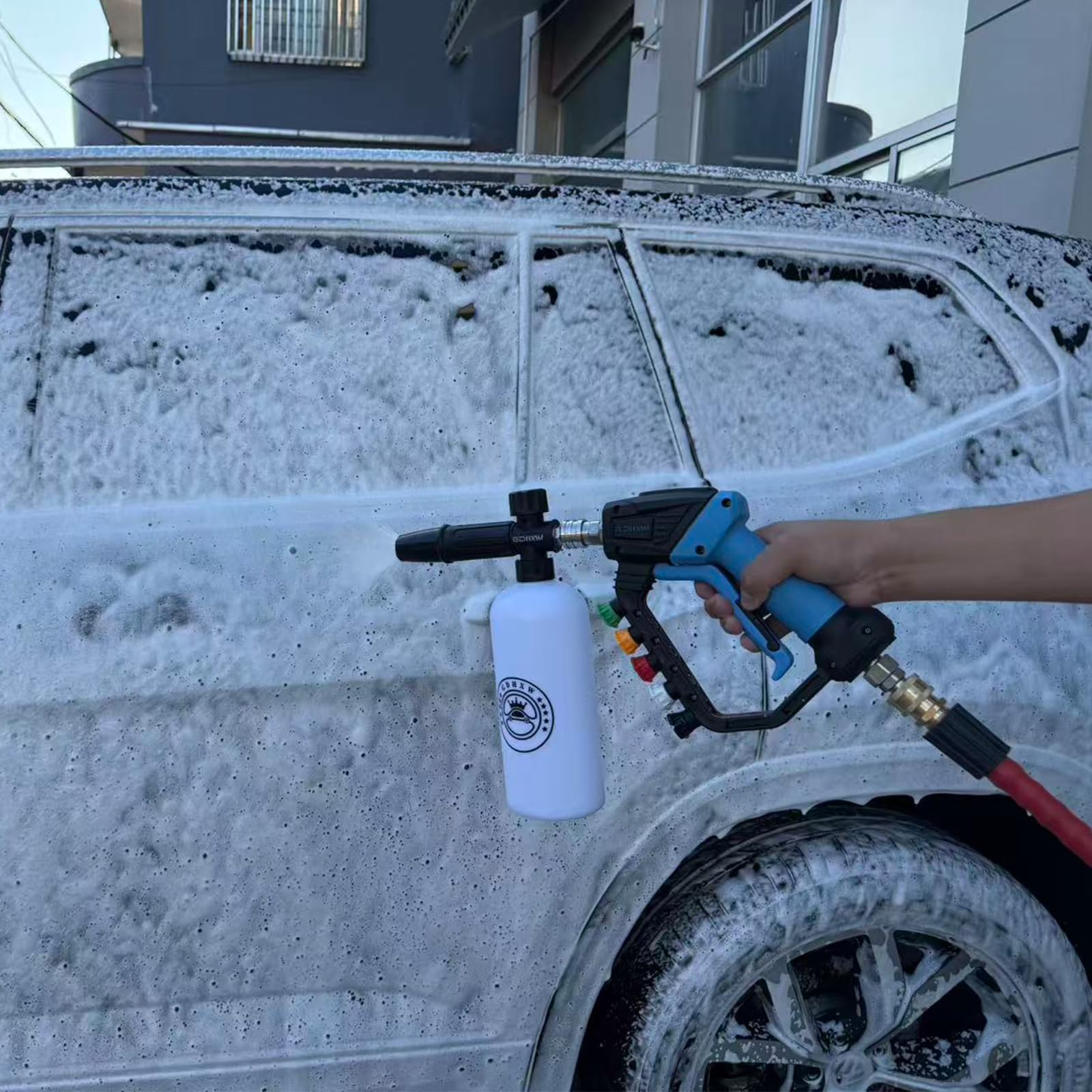 GDHXW pressure washer gun in use cleaning a driveway for efficient heavy-duty cleaning benefit