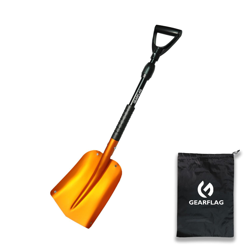 GEARFLAG shovel clearing snow around a vehicle tire to aid emergency roadside recovery