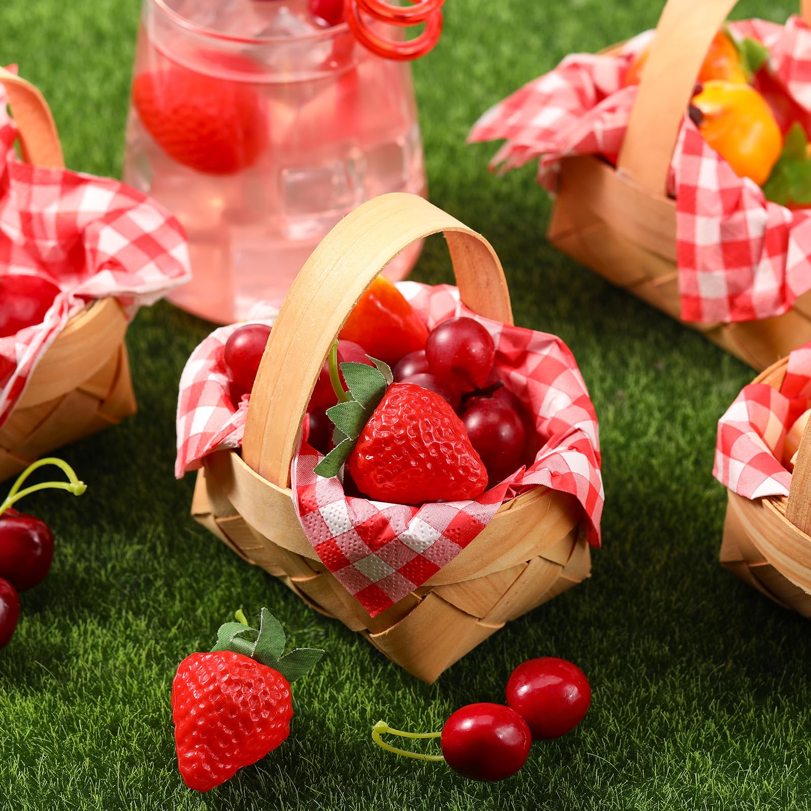 Geelin folded red-and-white gingham napkins displayed, adding classic picnic appeal