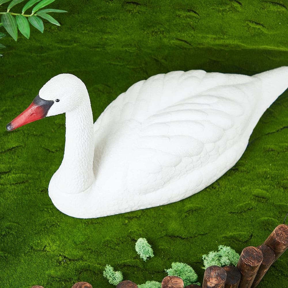 Geetery hand assembling swan head into body for quick installation