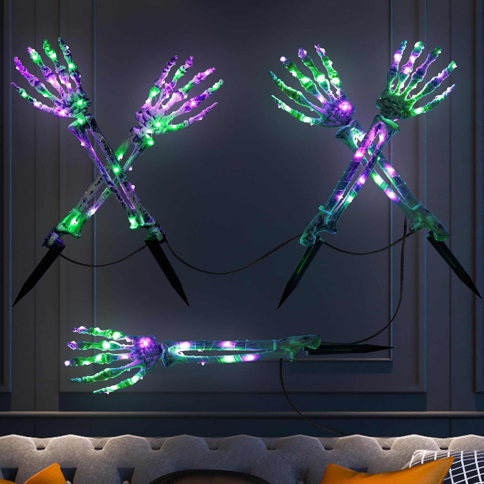 Gemce skeleton arms lit at night lining a pathway to create an eerie Halloween effect