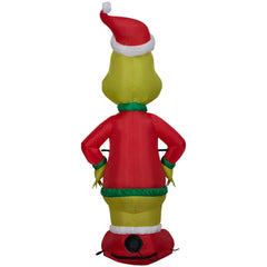 Gemmy Grinch staked in yard demonstrating stable outdoor display and durability