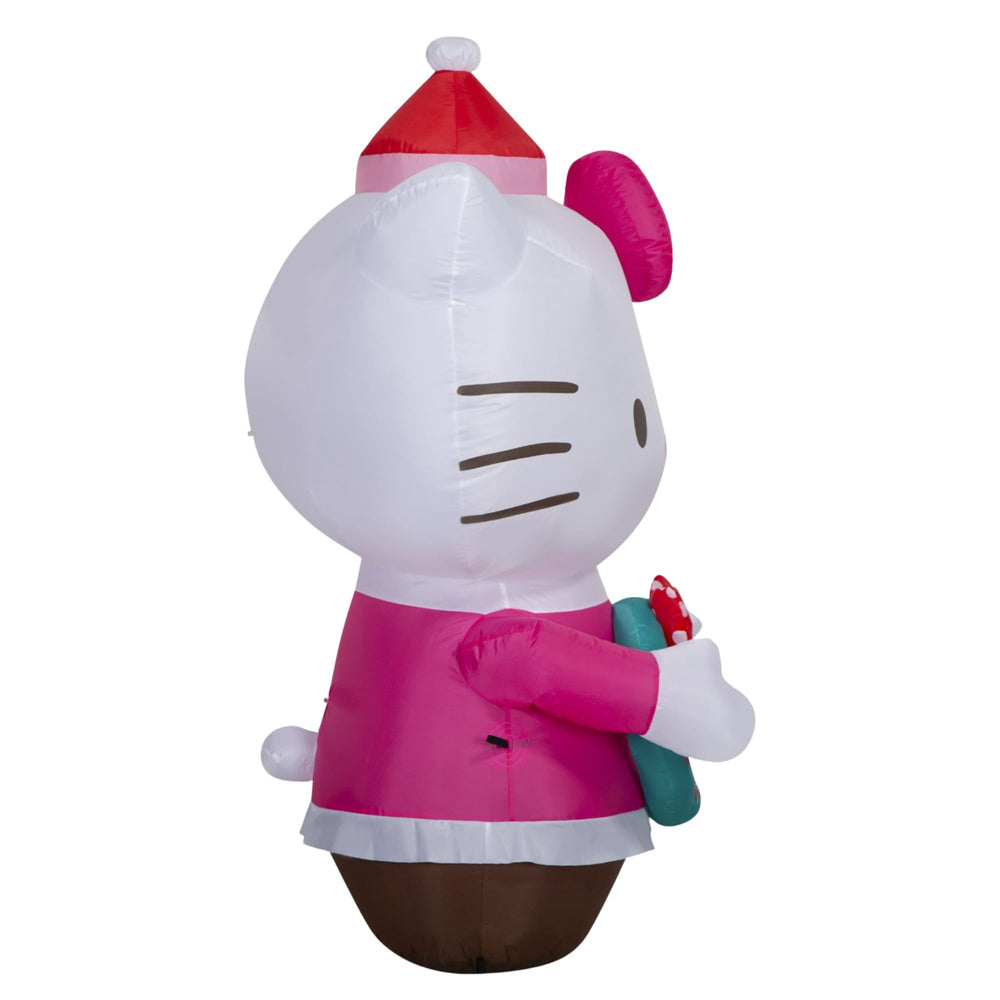 Gemmy Hello Kitty next to chair shows true 4.5-foot size advantage