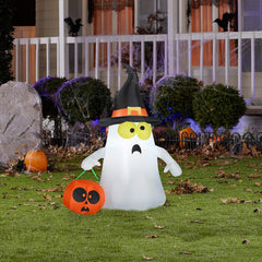 Gemmy inflatable ghost lit at night creating visible yard focal point