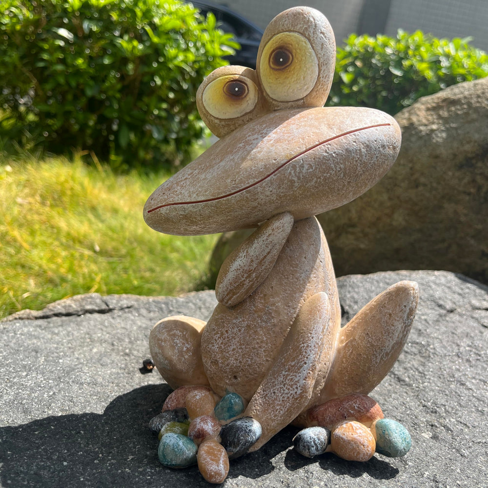 Generic frog on indoor shelf bringing cheerful decor to living space