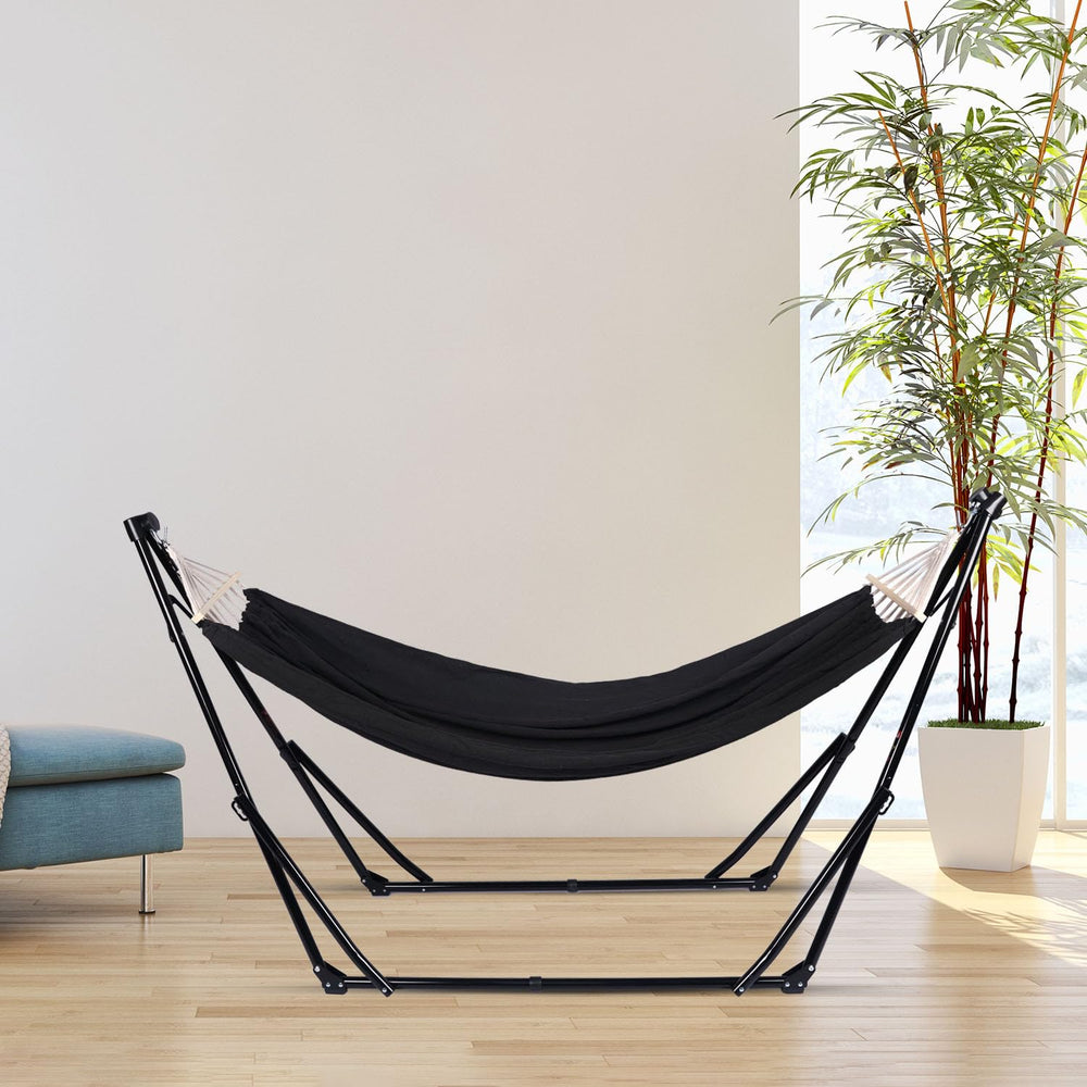 Generic brand next to a chair to show compact folded size and portability