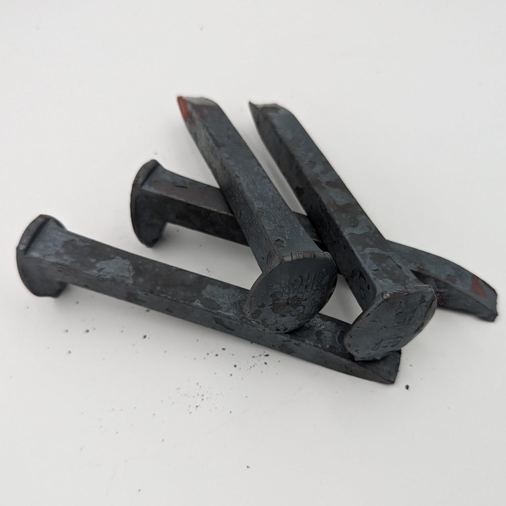 Generic brand close-up of spike head showing texture and marking, aids precise forging