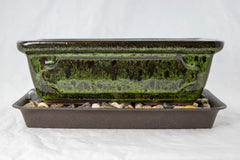 Generic moss green pot front view showing clean lines and glazed finish