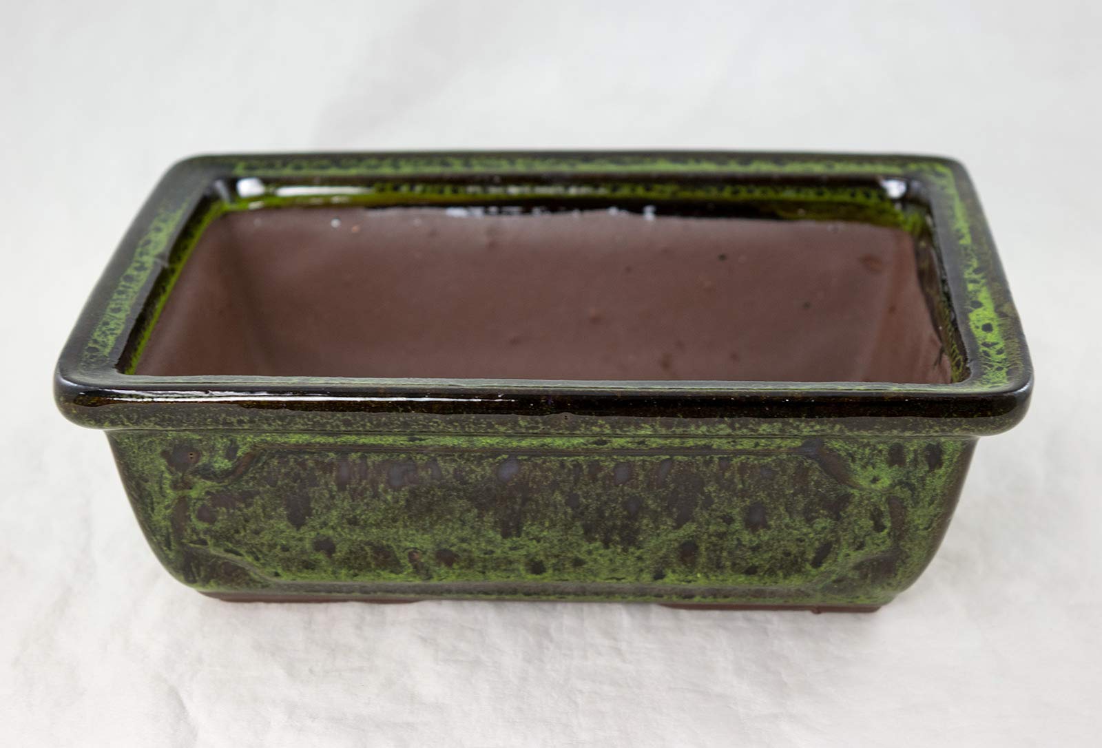 Generic planter seated on included rectangular tray showing fit and protection