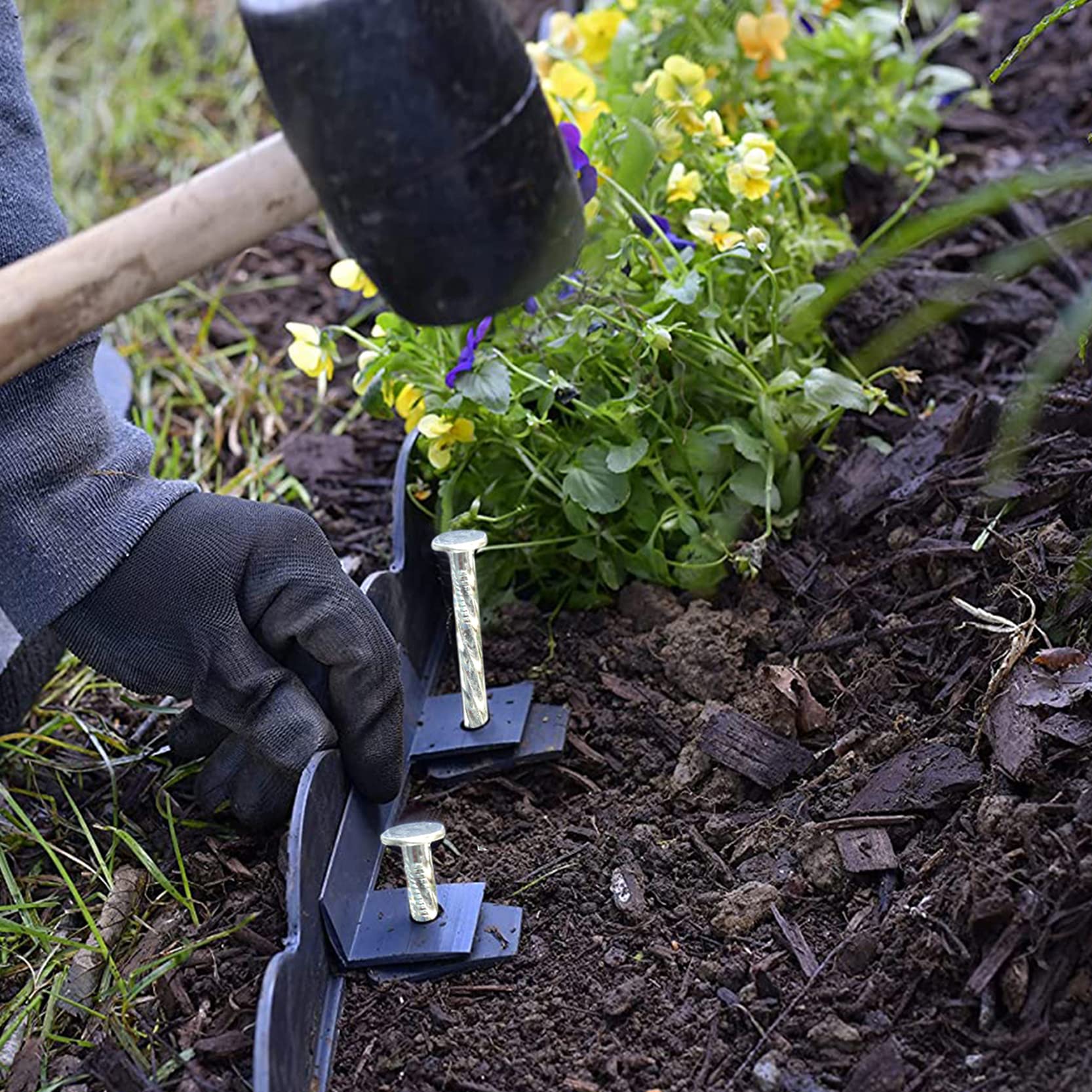 Generic landscape stakes securing artificial turf edge to prevent movement and lifting