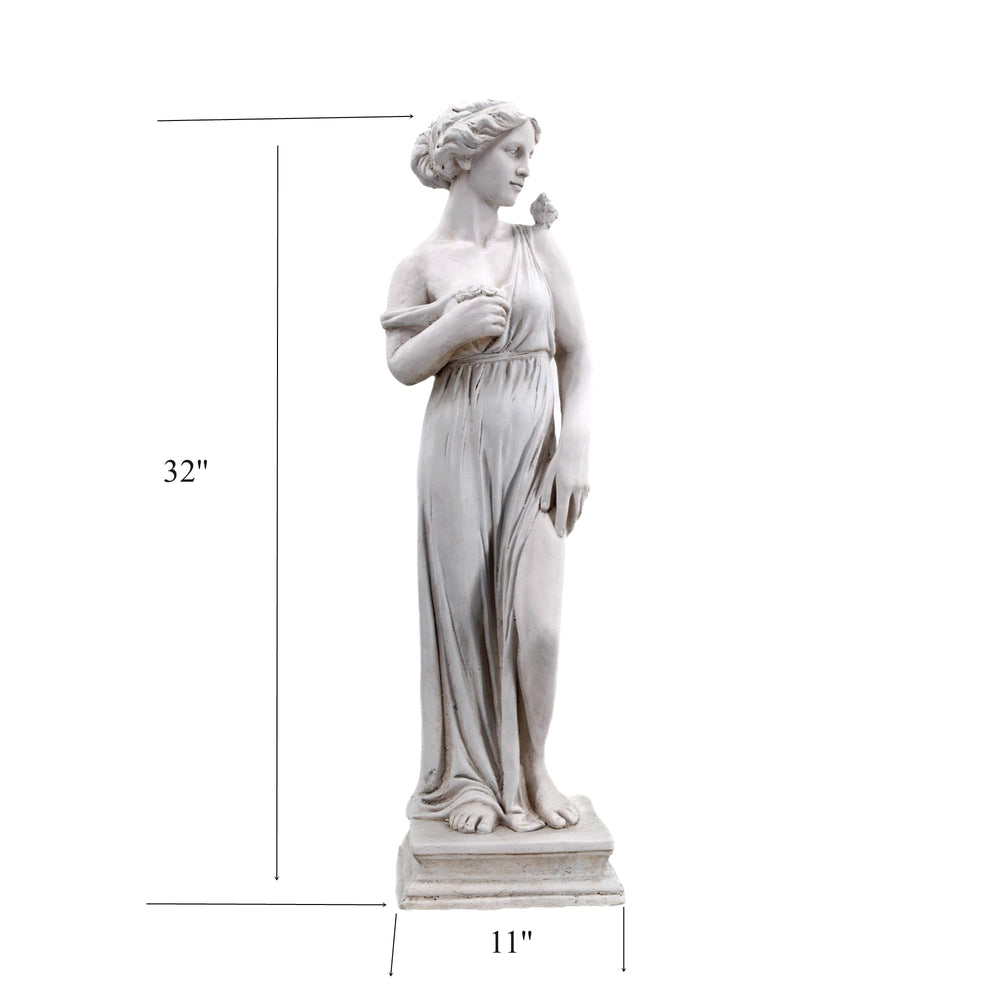 GENUINQ statue in garden setting anchoring a flower bed with classic style