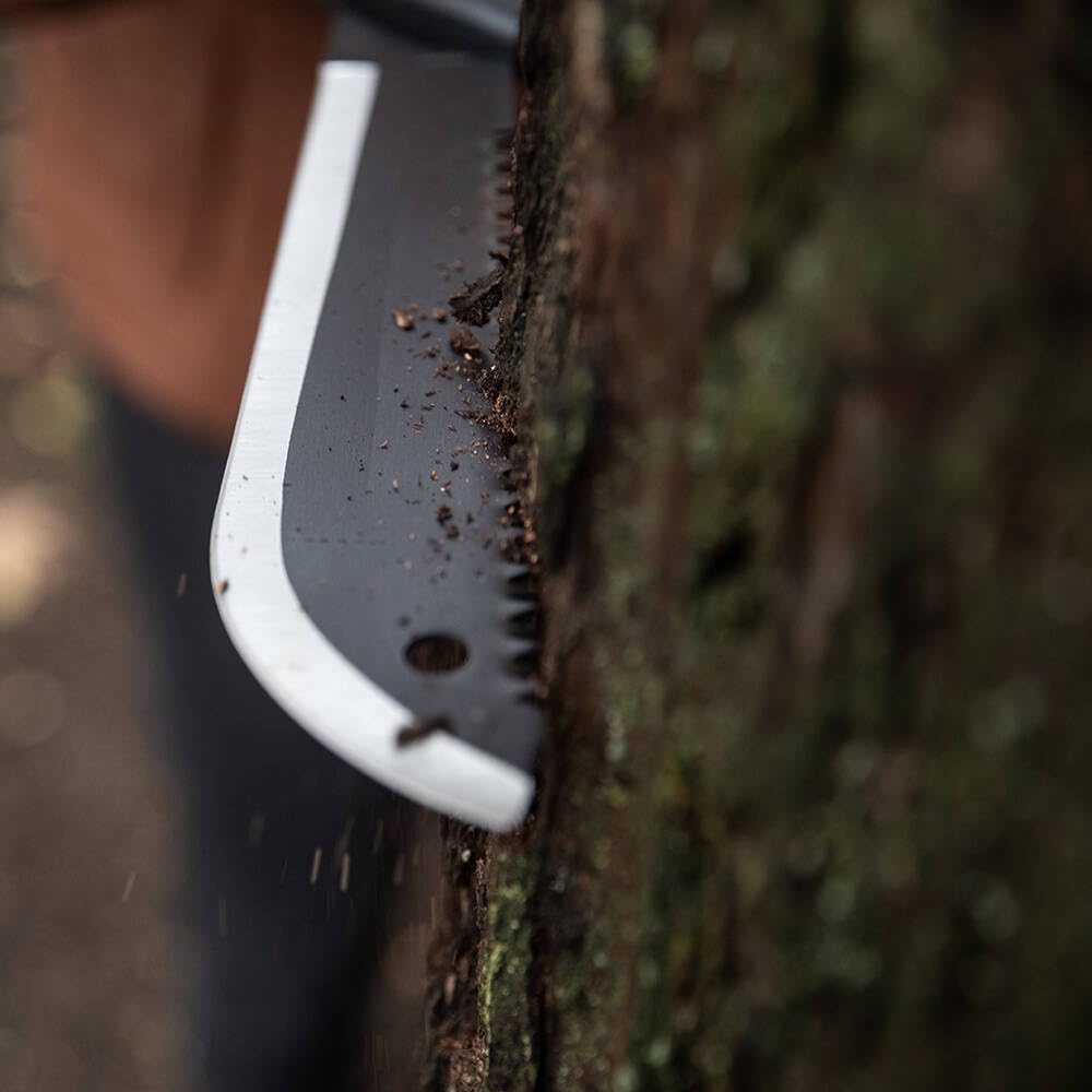 Gerber Gator machete jr beside a backpack showing compact size for packability