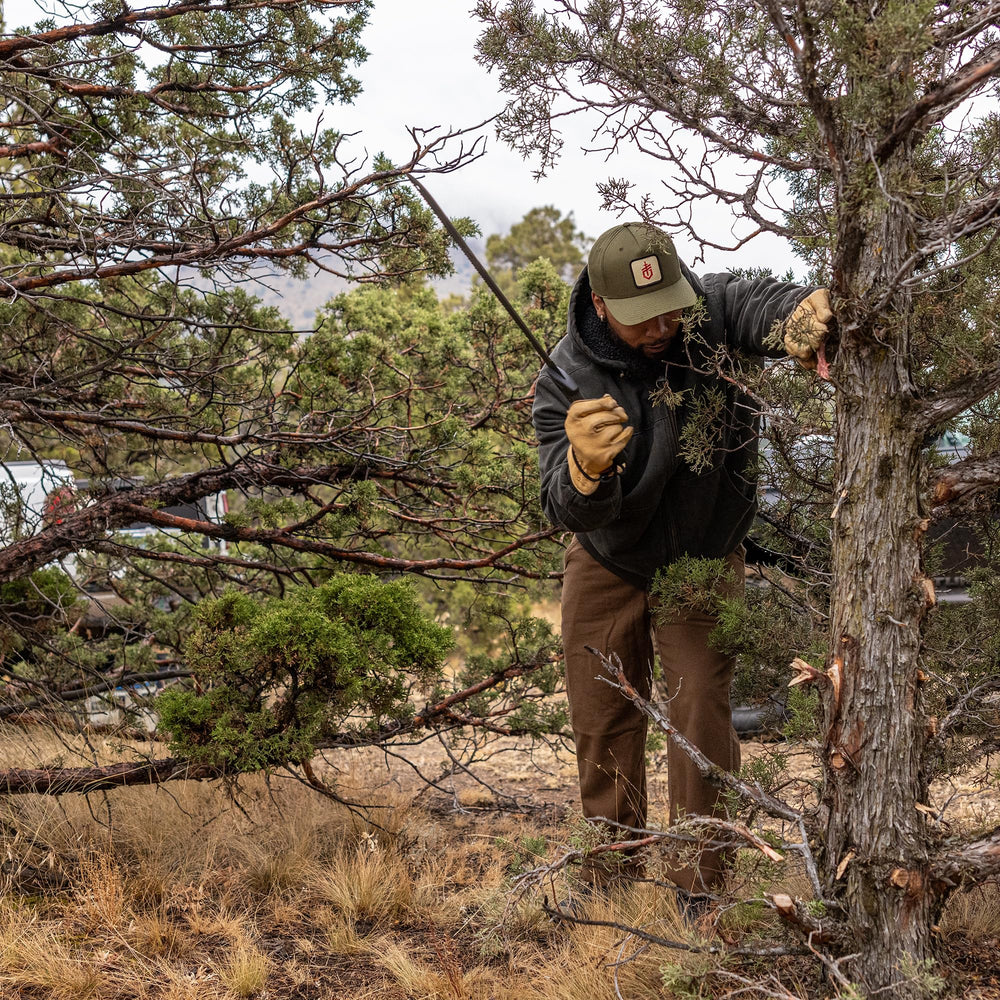 Gerber machete on campsite log showing versatile field use and reliability