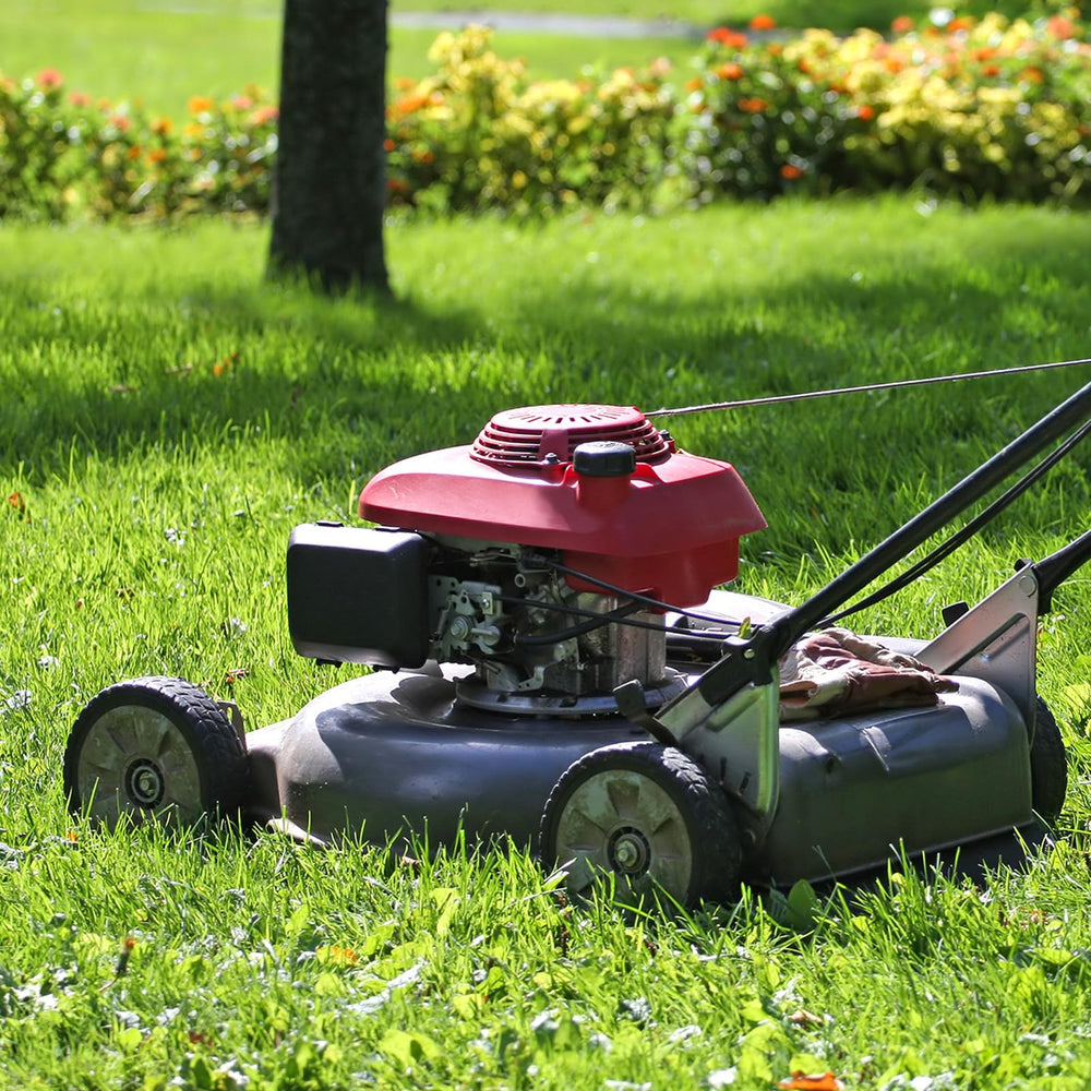 GICOOL wheels installed on lawn mower in grass showing smooth operation and traction