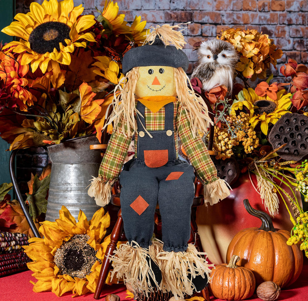 Gift Boutique scarecrow styled on porch creating festive harvest atmosphere