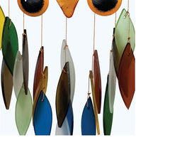 Gift Essentials Spiky Owl hanging in garden adding charm and gentle sound outdoors